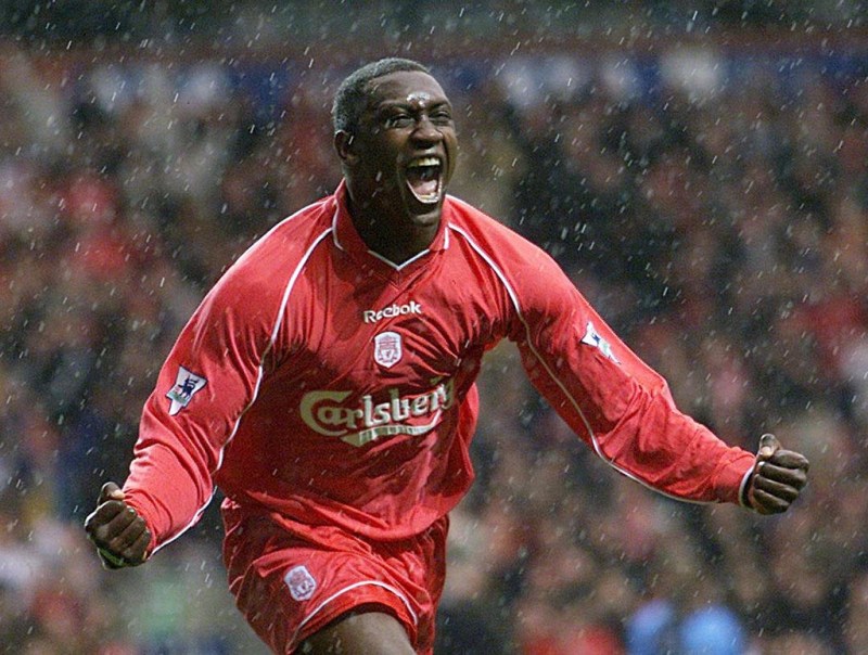 BIR04-20010408-LONDON, UNITED KINGDOM: Liverpool striker Emile Heskey celebrates in the pouring rain after scoring his team's first goal against  Wycombe Wanderers 08 April 2001, during their F.A. Cup semi-final match at Villa Park, Birmingham.    EPA PHOTO         EPA/GERRY PENNY